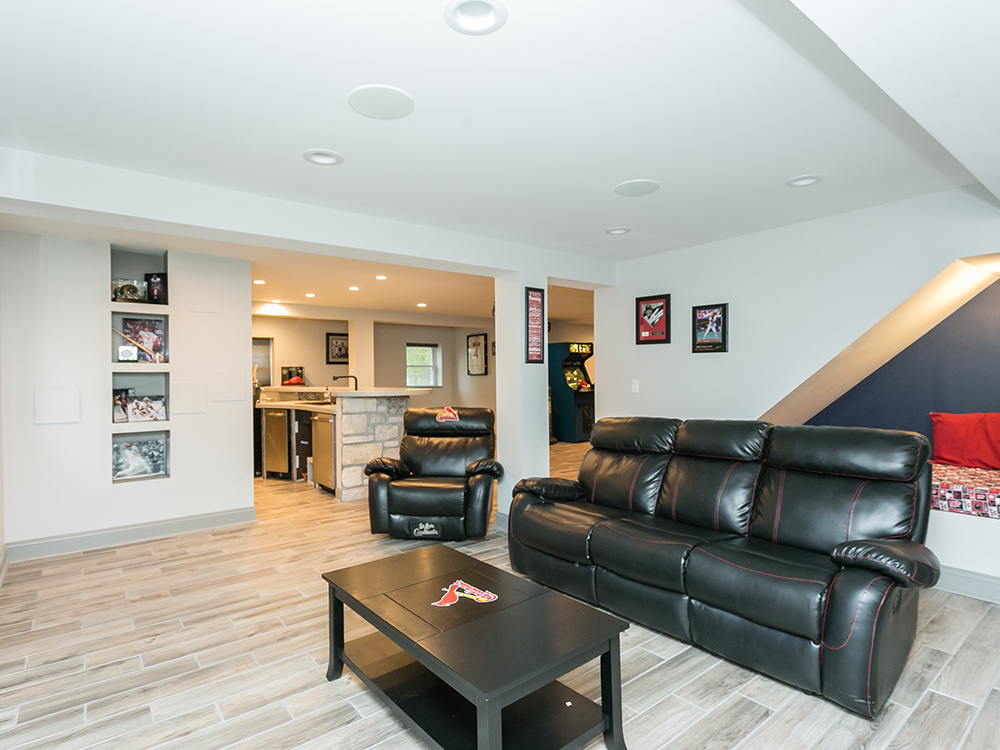 basement with black couch