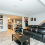 basement with black couch