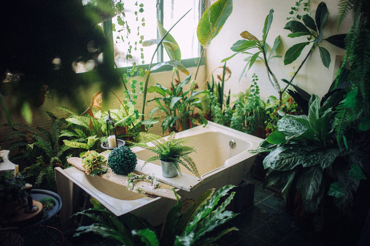 plants around tub boho bathroom